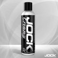 8oz bottle of JOCK Creamy Lubricant with a bold black and white label featuring vertical typography.