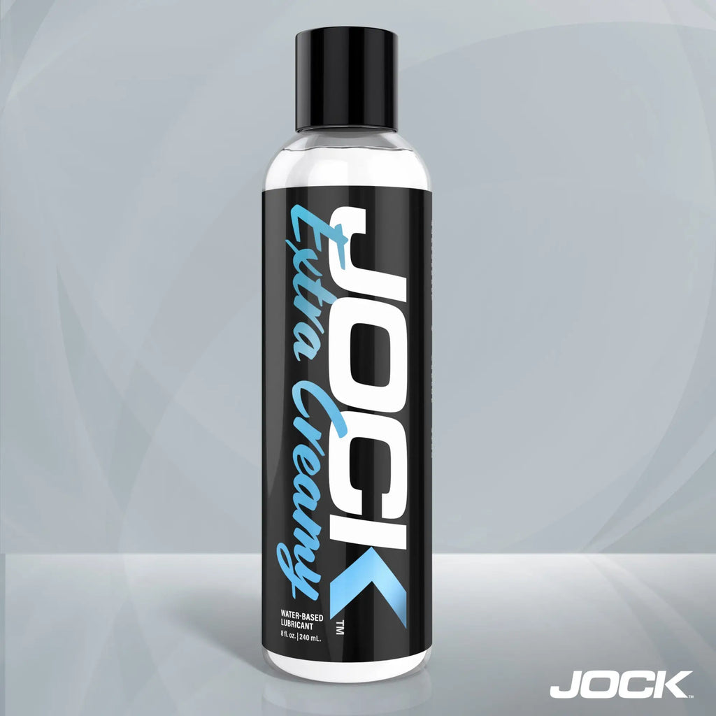 An 8oz bottle of JOCK Extra Creamy water-based lubricant, featuring a black label with white and light blue text.