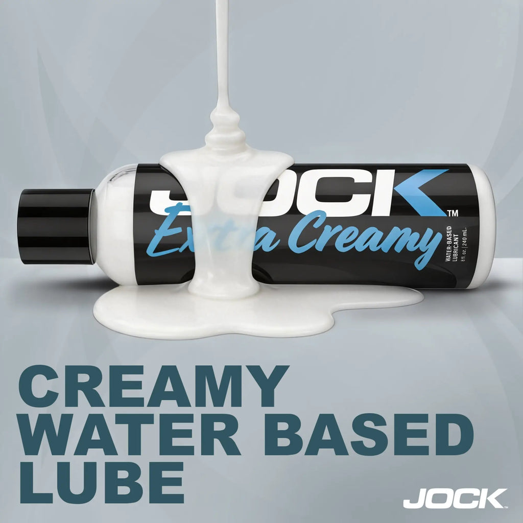 JOCK Extra Creamy water-based lubricant 8oz bottle shown horizontally with white cream pouring over it.