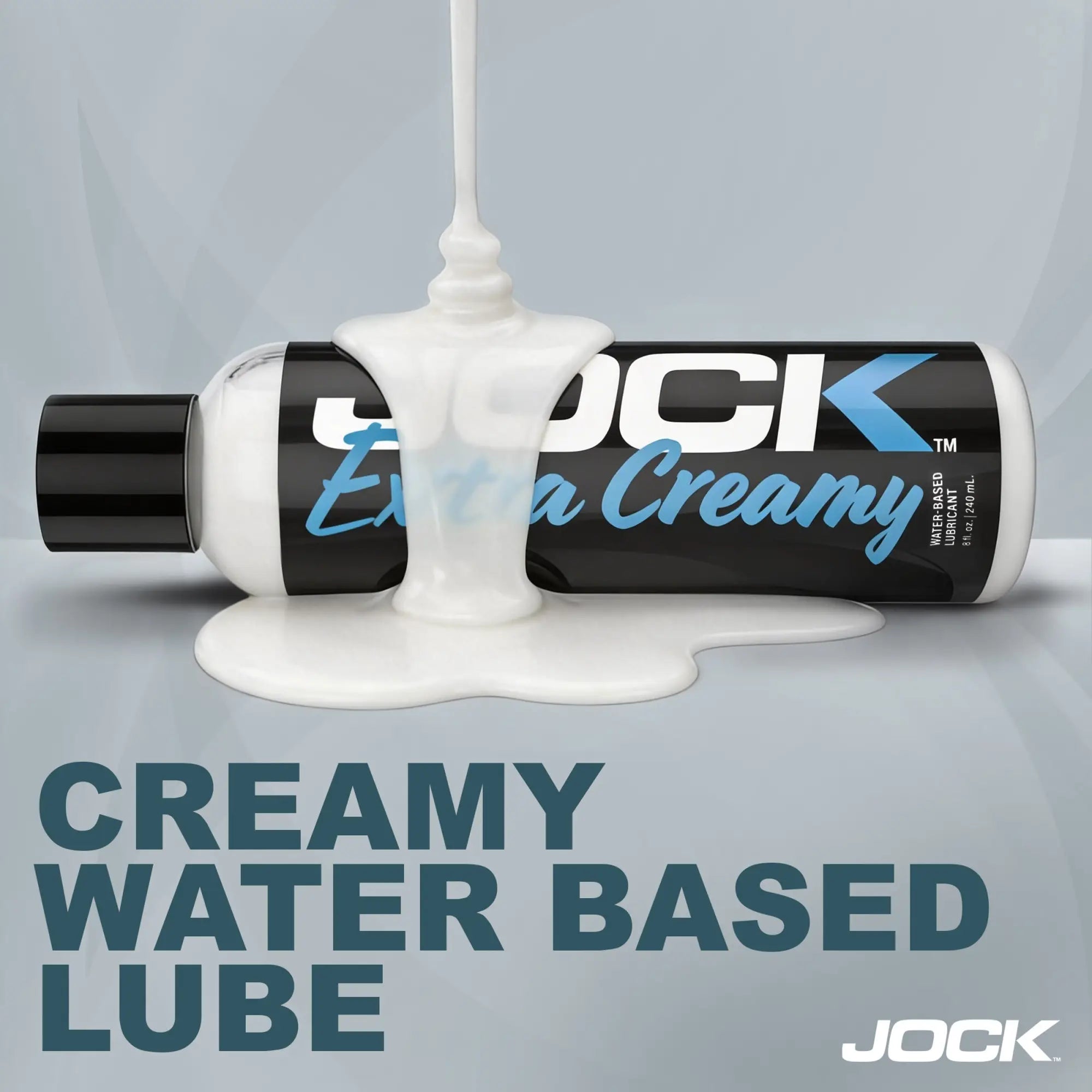 JOCK Extra Creamy water-based lubricant 8oz bottle shown horizontally with white cream pouring over it.