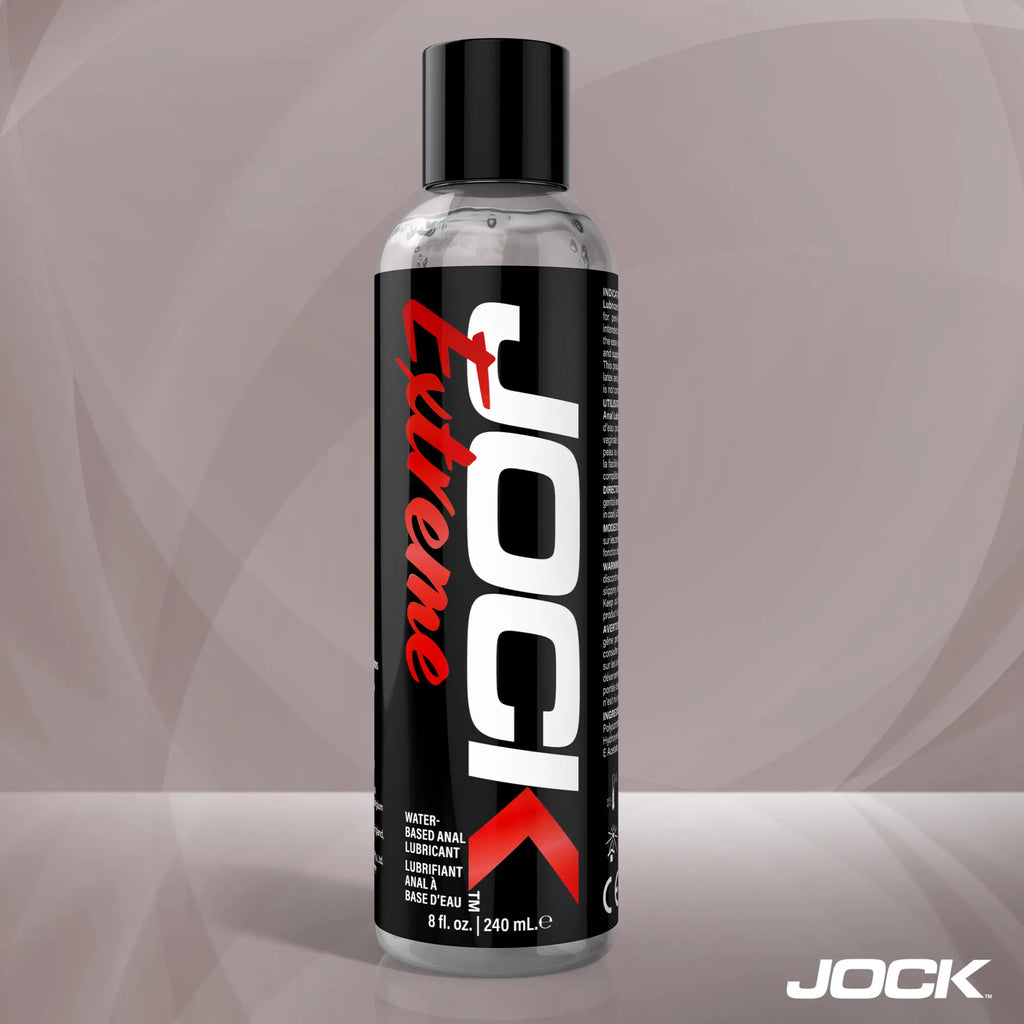 An 8oz clear bottle of JOCK Extreme water-based anal lubricant with a black label, white lettering, and red accents.
