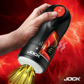 A hand holds a black and red Jock Gyroblast masturbator against a vibrant, fiery red background.