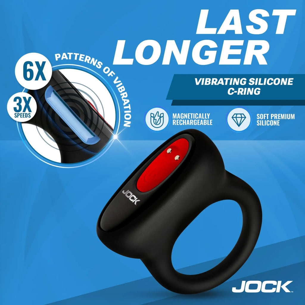 Jock Hard-On black silicone C-ring with red vibration control button on a blue background.