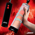 Jock Power Up automatic penis pump with a black controller and clear cylinder held against a red abstract background.