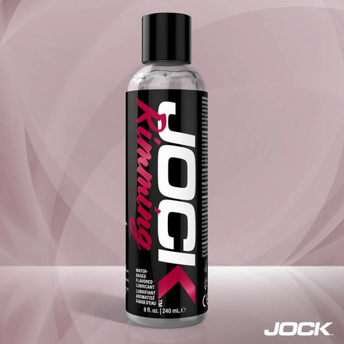 An 8oz bottle of JOCK Rimming Lubricant (Cherry) with a black label, white branding, and pink text on a light background.