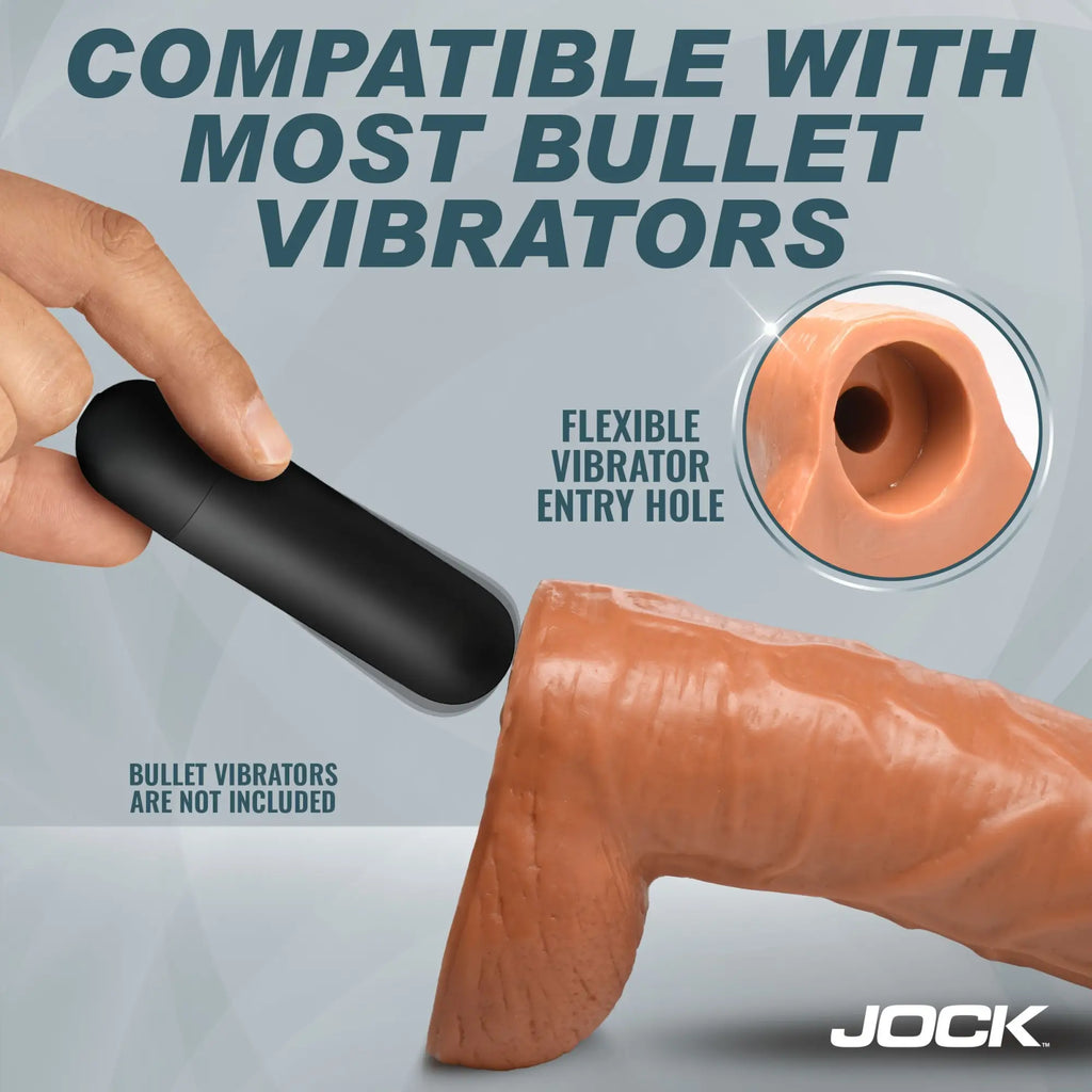 Jock Jock's 9-inch tan dildo with balls, showing a hand inserting a black bullet vibrator into its flexible base hole.