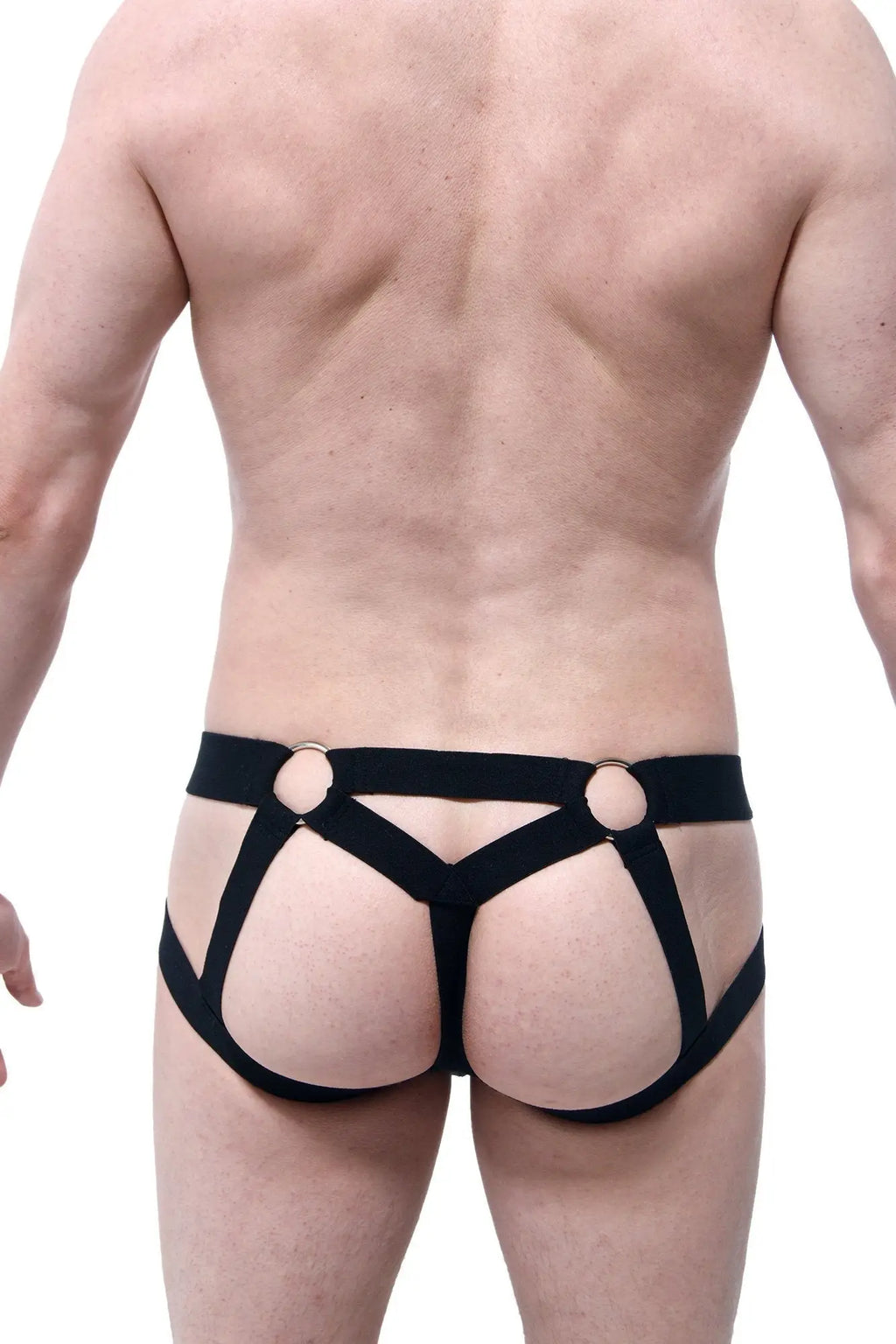 Black harness-style jockstring beast briefs with gold-toned metal rings at the waistband front view