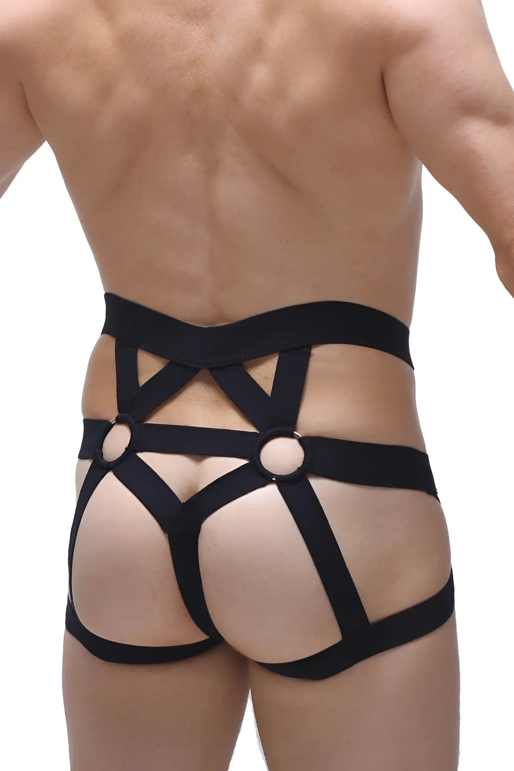 Black elasticated jockstring bustic harness with crisscross straps and circular metal rings shown from the back side