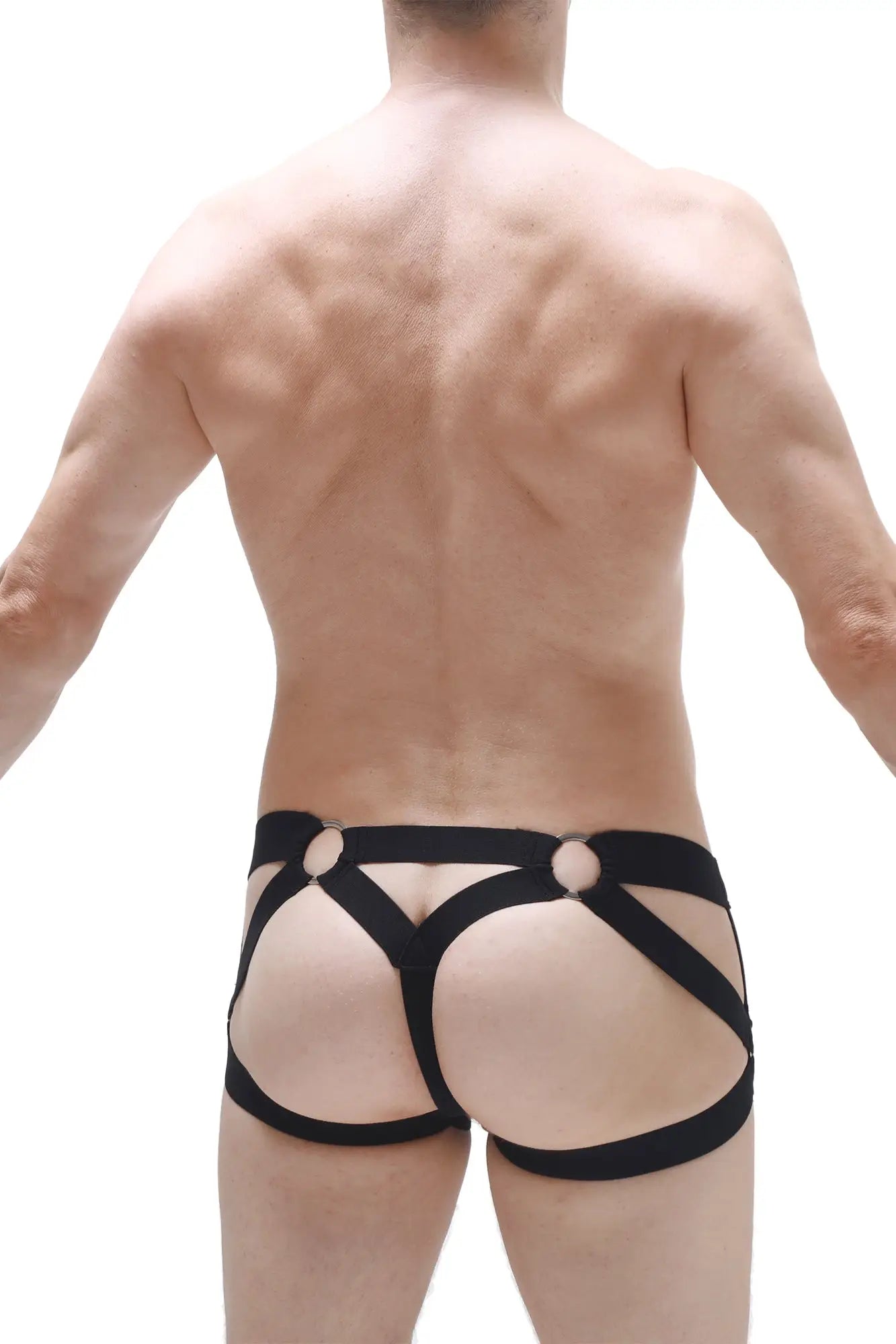 Black harness-style jockstring bustic briefs with bold straps and circular metal accents for edgy lingerie look