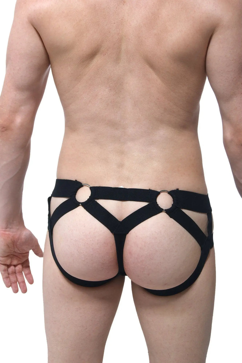 Back view of black elasticated harness-style jock thong with circular metal rings made by petitq