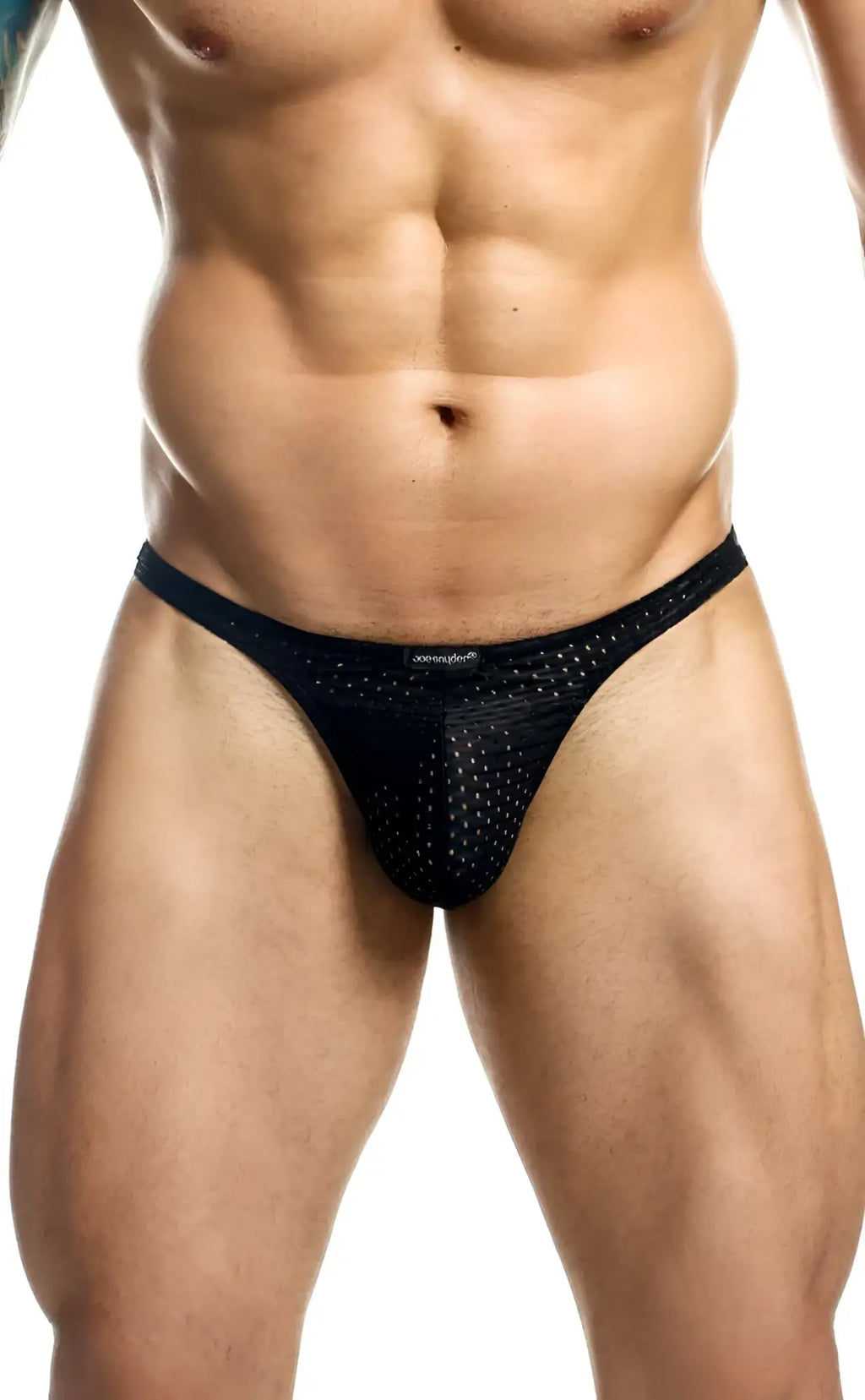 Black mesh thong with perforated design and small joe snyder brand tag at waistband visible from the back