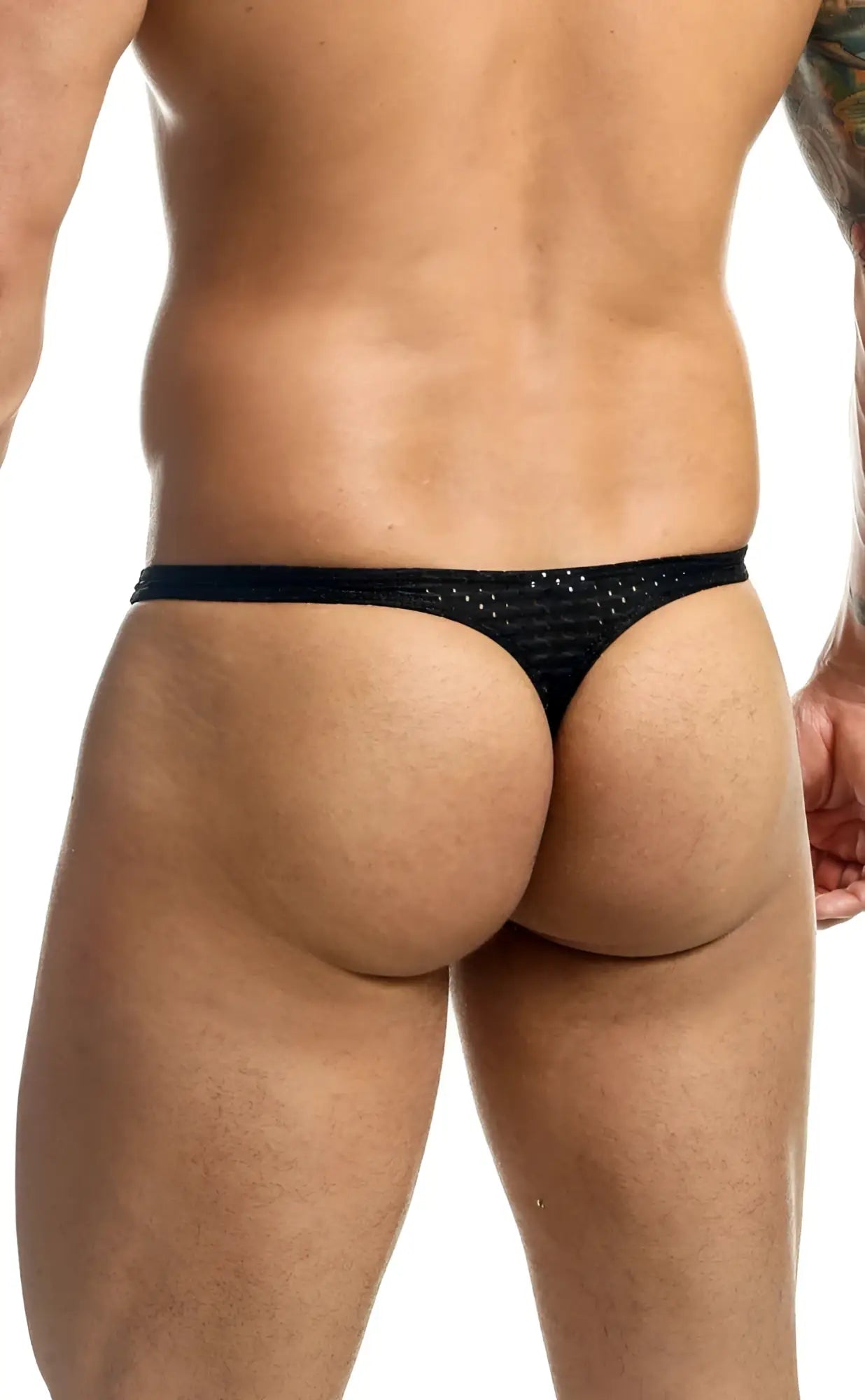 Black Joe Snyder Holes thong with a textured sequined pattern across the fabric showing the back side