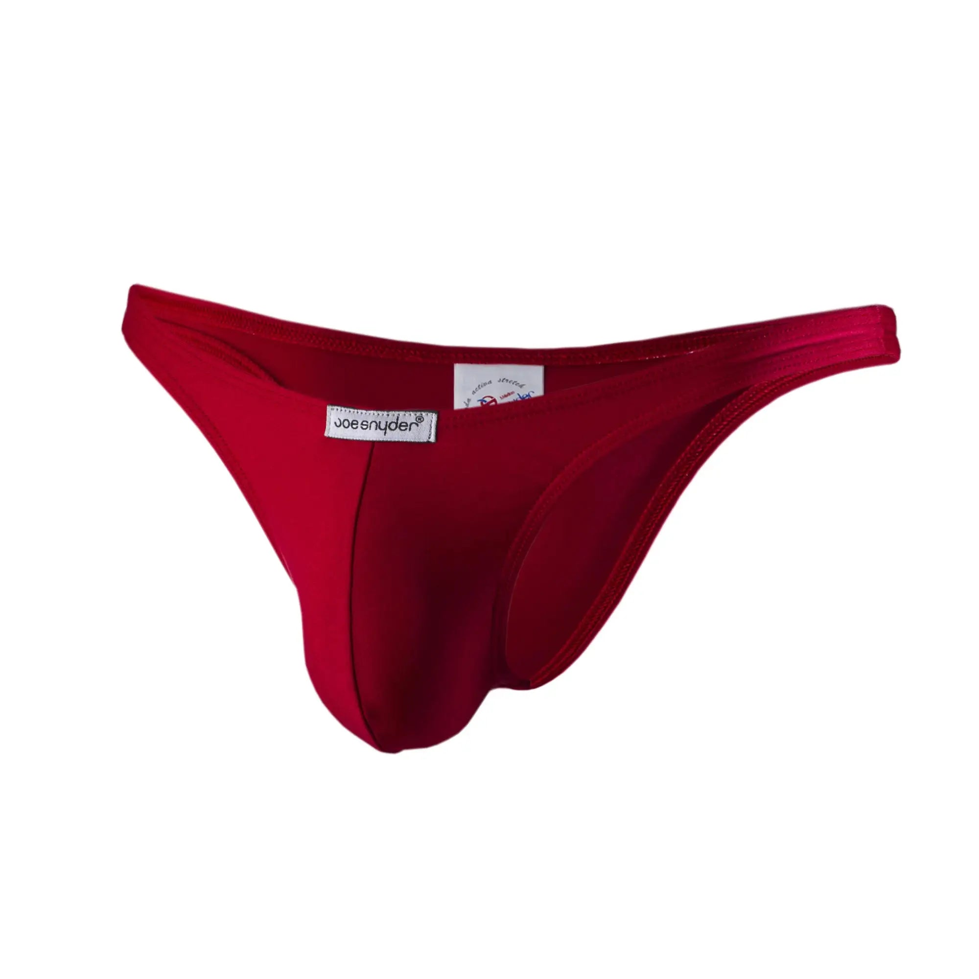 A vibrant red form-fitting thong made of smooth stretchy polyester with a joe snyder branded label