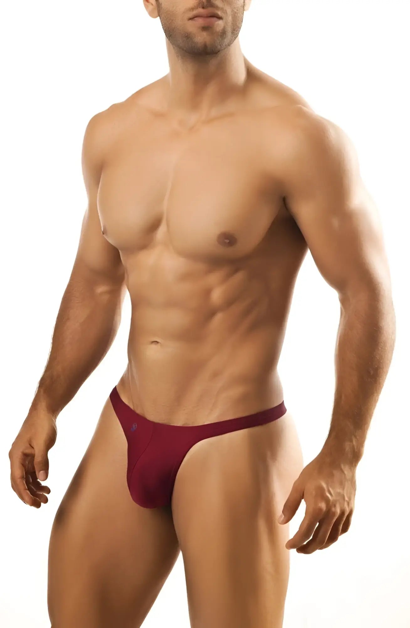 A maroon joe snyder thong made of smooth fabric with a narrow waistband and minimal coverage shown from the back