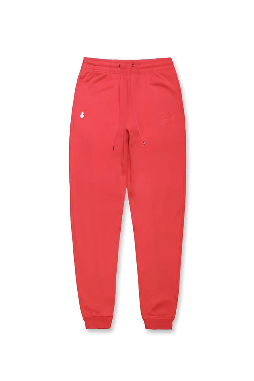 Joie Limited Edition joggers in cherry red with soft stretchy fabric and subtle embroidered logos on the thigh