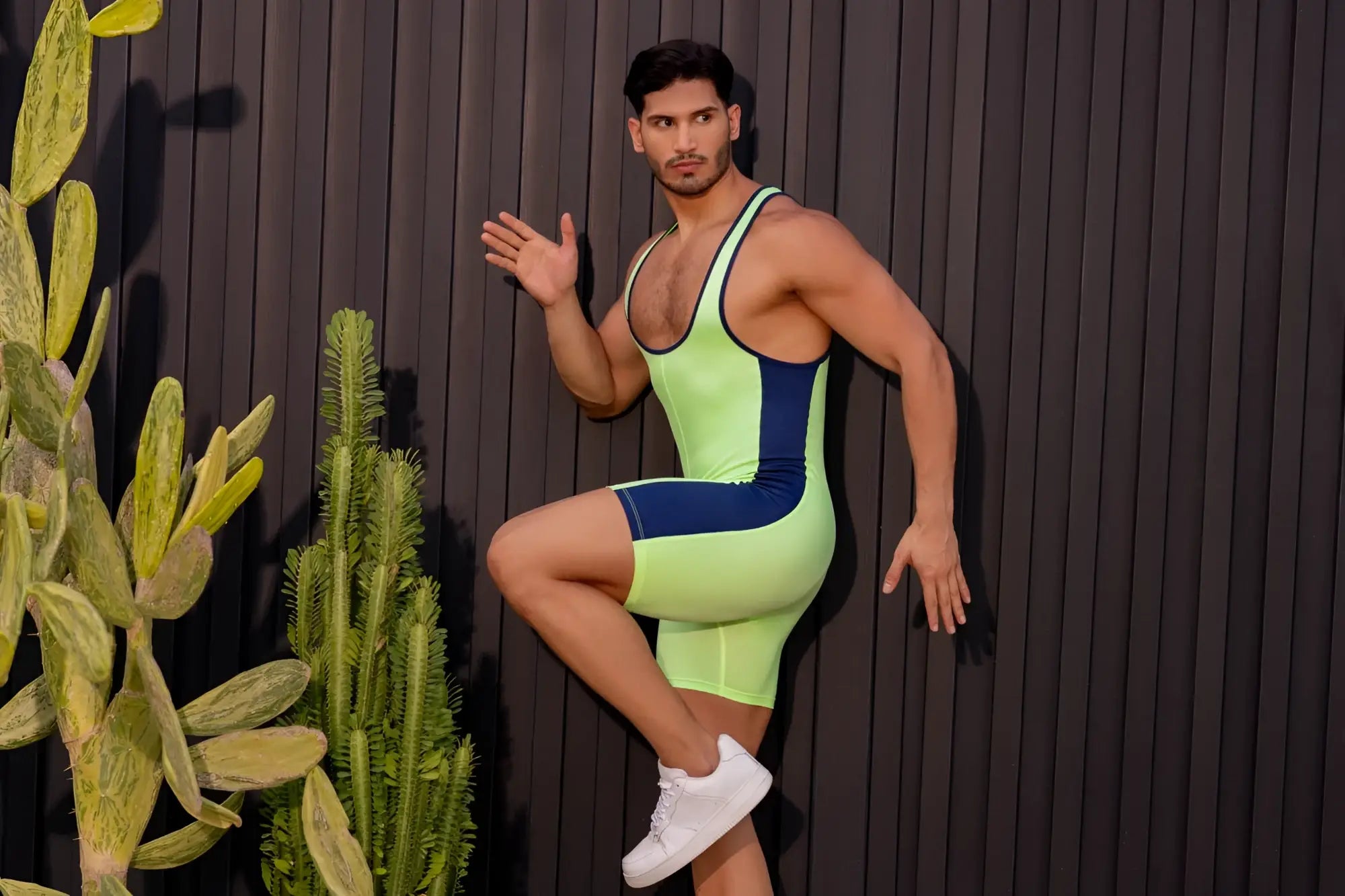 Neon green and navy blue jor 2216 fighter bodysuit in a sleek, form-fitting athletic one-piece design