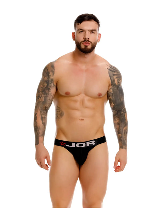 Black jor 2332 cronos jockstrap briefs with white logo and red star detail on waistband in black color