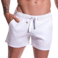 White jor arrecife copacabana mini shorts with drawstring elastic waistband and relaxed fit in size m swimwear
