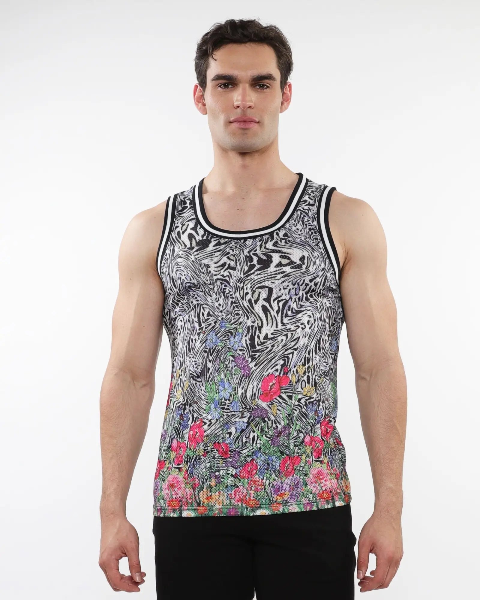 Jungle printed mesh tank with stripe ribbing featuring black and white abstract pattern and vibrant floral hem accents