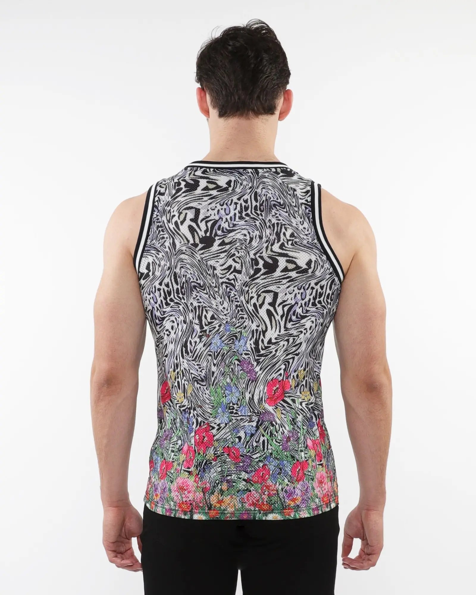 Black and white abstract swirl mesh tank top with colorful floral print and stripe ribbing at the bottom front