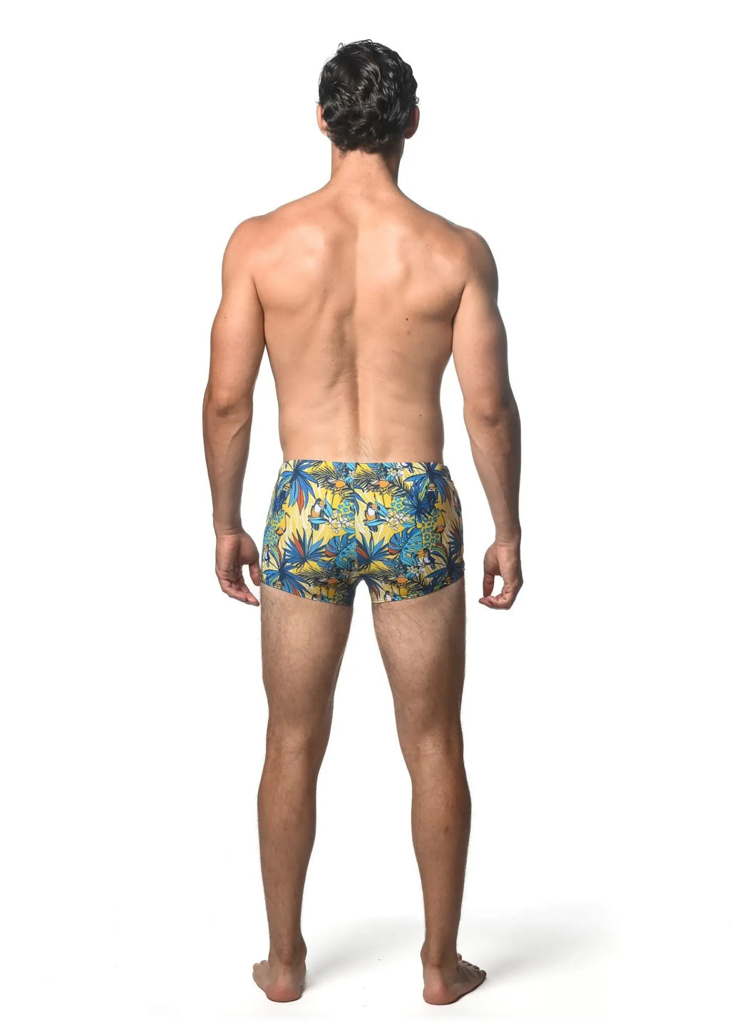 Men’s jungle printed swim trunk with vibrant tropical yellow and blue palm leaf pattern for beachwear
