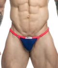 Justin and Simon bikini one athletic briefs in bright pink and navy blue with white Artin Simon brand tag visible