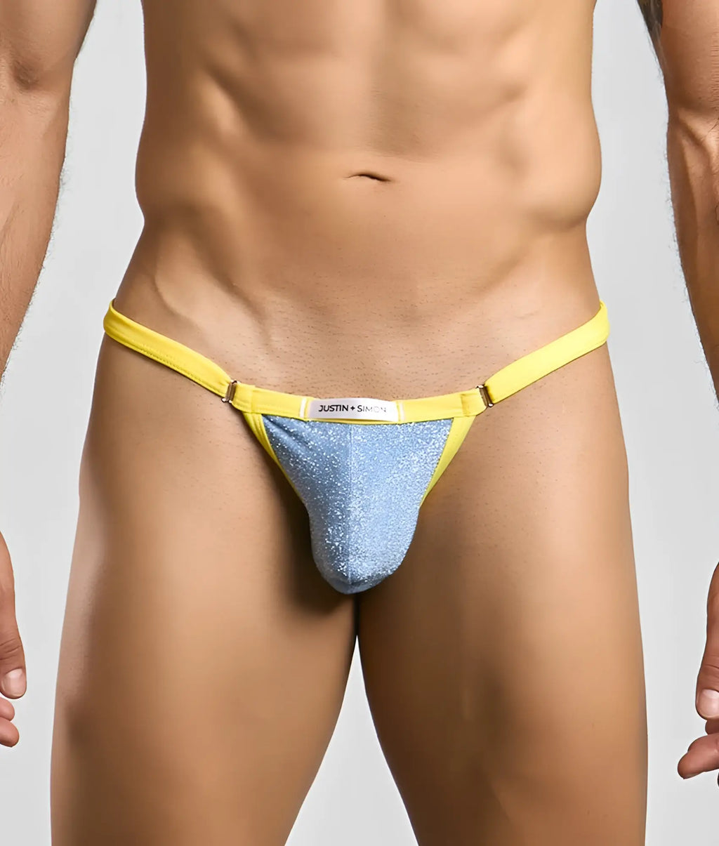 Bright yellow and shimmering blue glittery thong with justin simon brand label from the Justin + Simon Bikini One collection