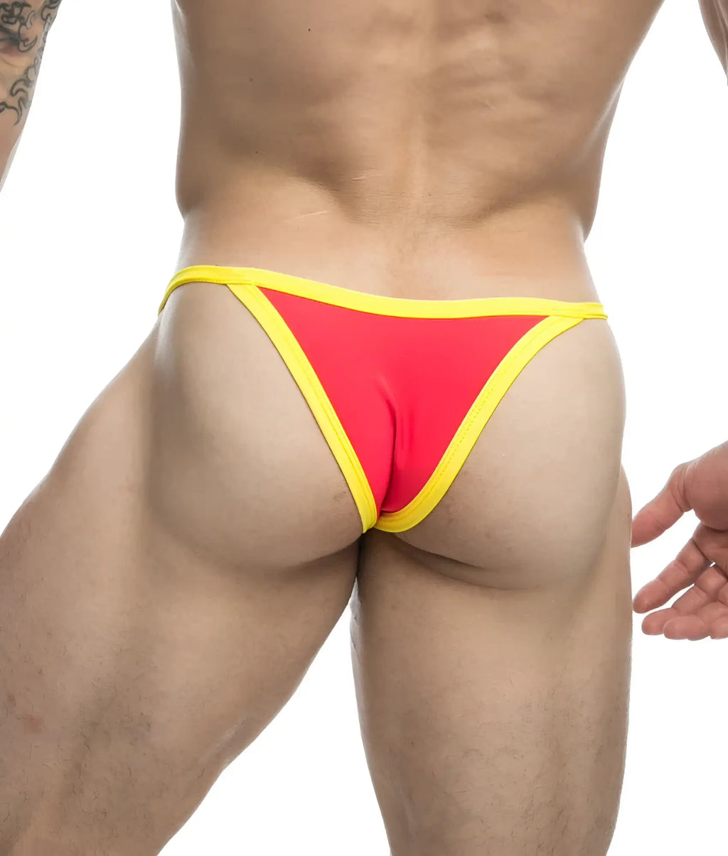 Vibrant red and yellow thong from justin + simon bikini one with snug form-fitting design