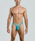 Vibrant turquoise justin + simon bulge thong with sleek form-fitting design and white brand label at the front
