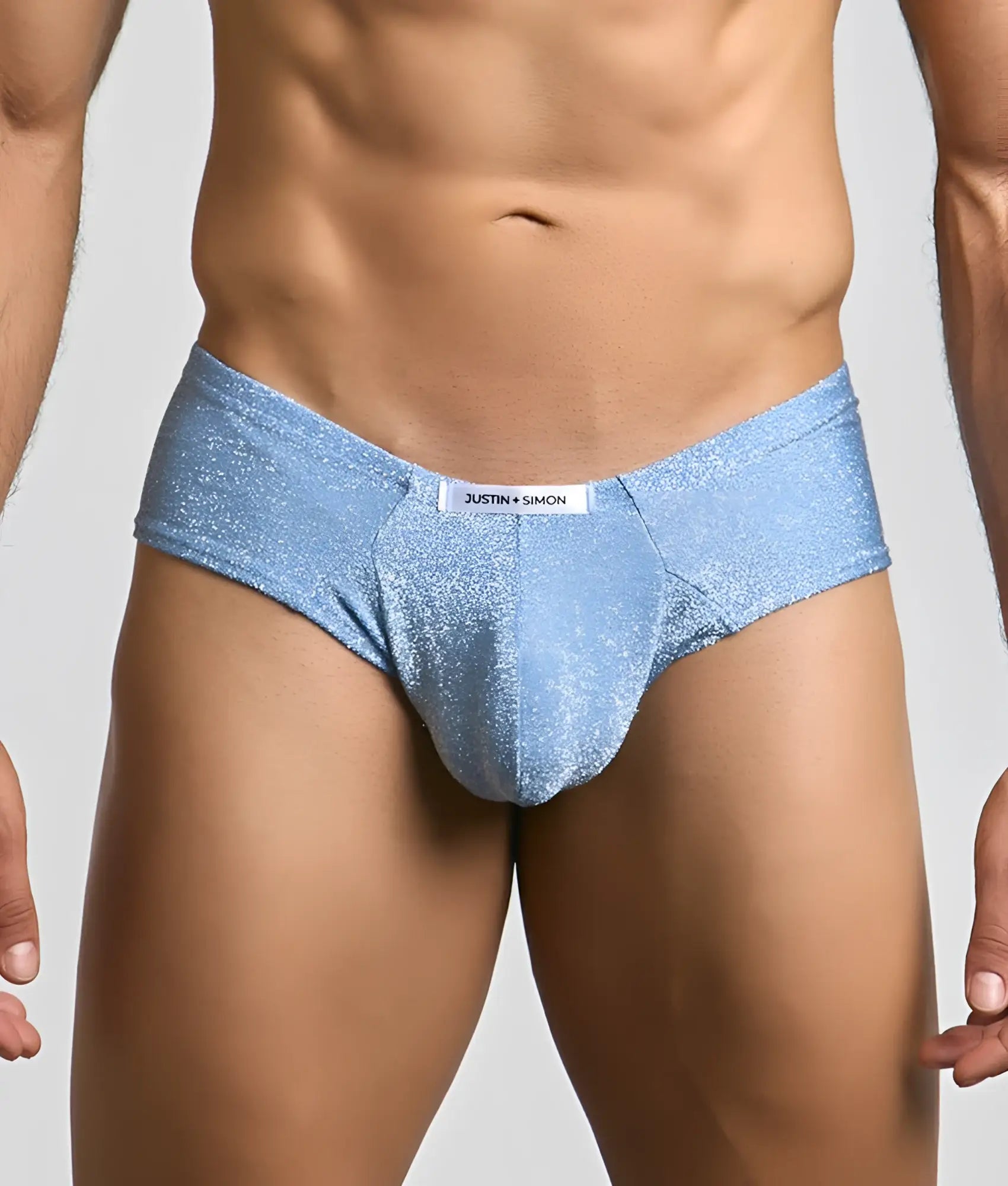 Light blue glittery fabric briefs with a white justin plus simon label at the waistband for stylish comfort