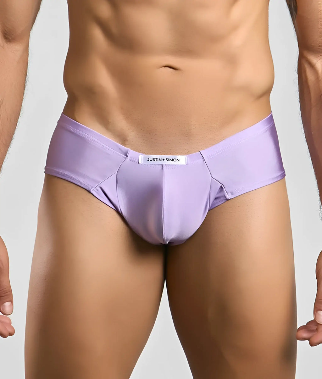 Purple justin simon cheek briefs with a smooth form-fitting fabric and white brand label at the waistband