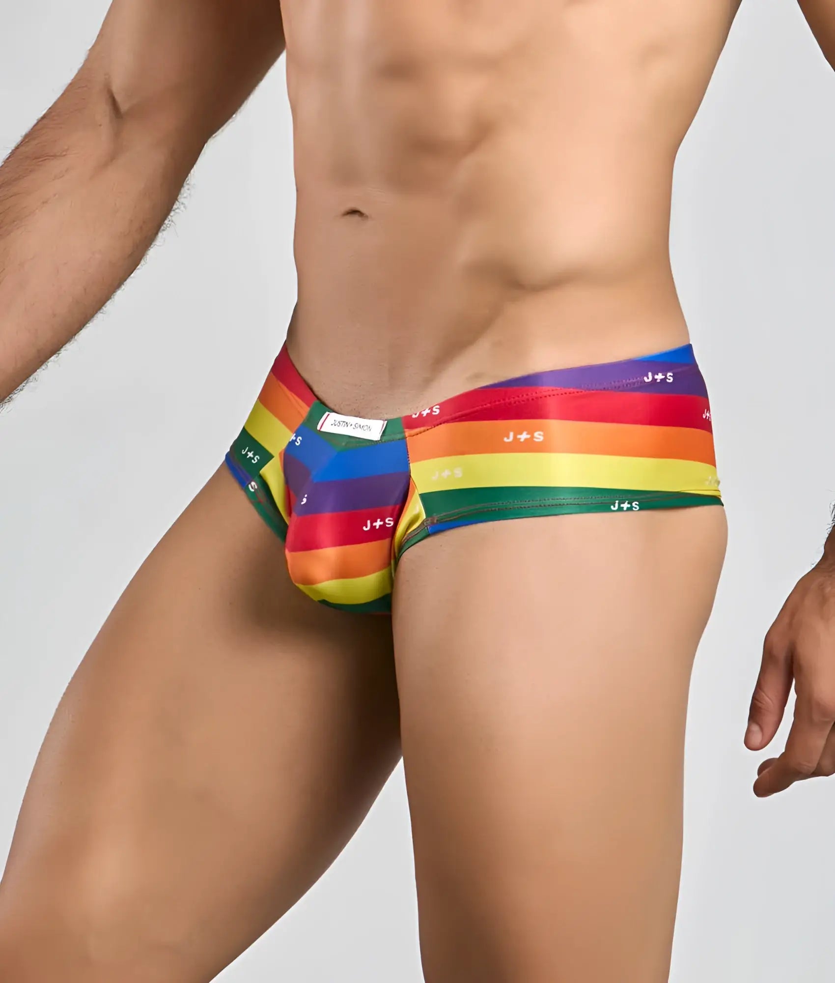 Rainbow-striped j+s men’s briefs with a snug form-fitting design from justin + simon cheek collection