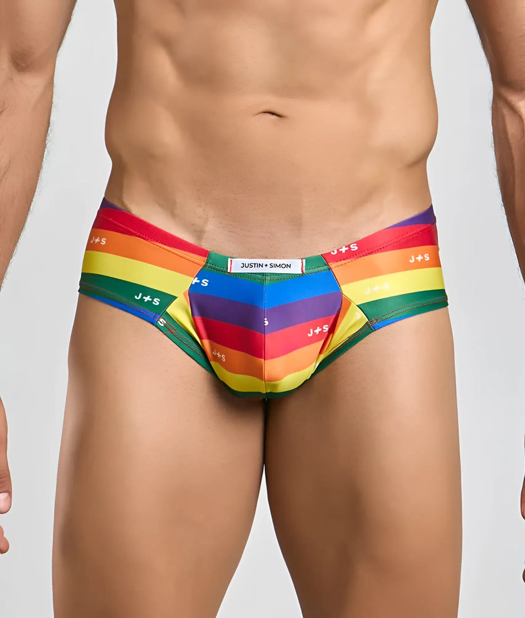 Rainbow-striped men’s briefs with js branding and central pocket made from stretchy fabric by justin simon cheek