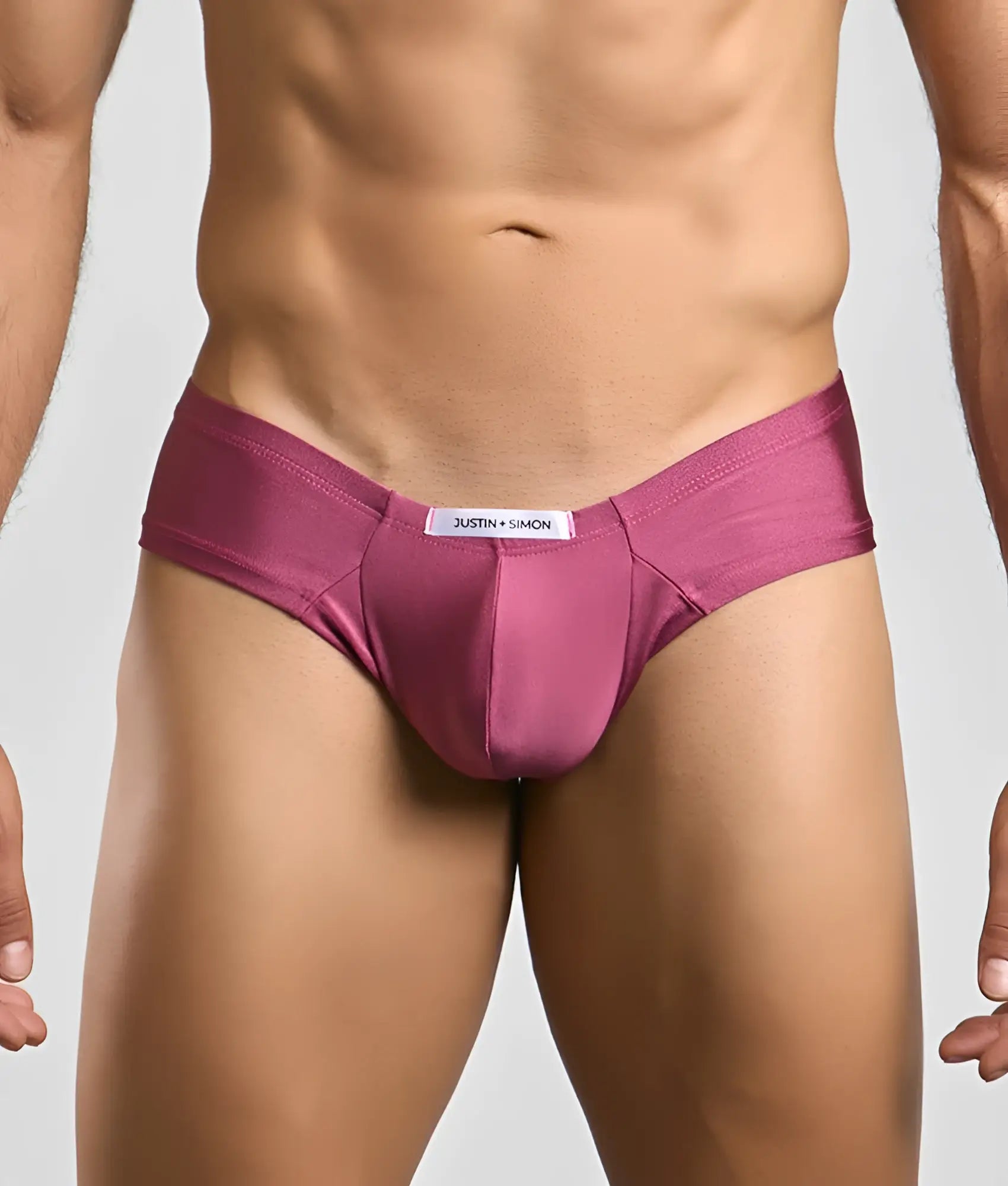A sleek satin-like magenta brief from justin simon in the justin simon cheek collection