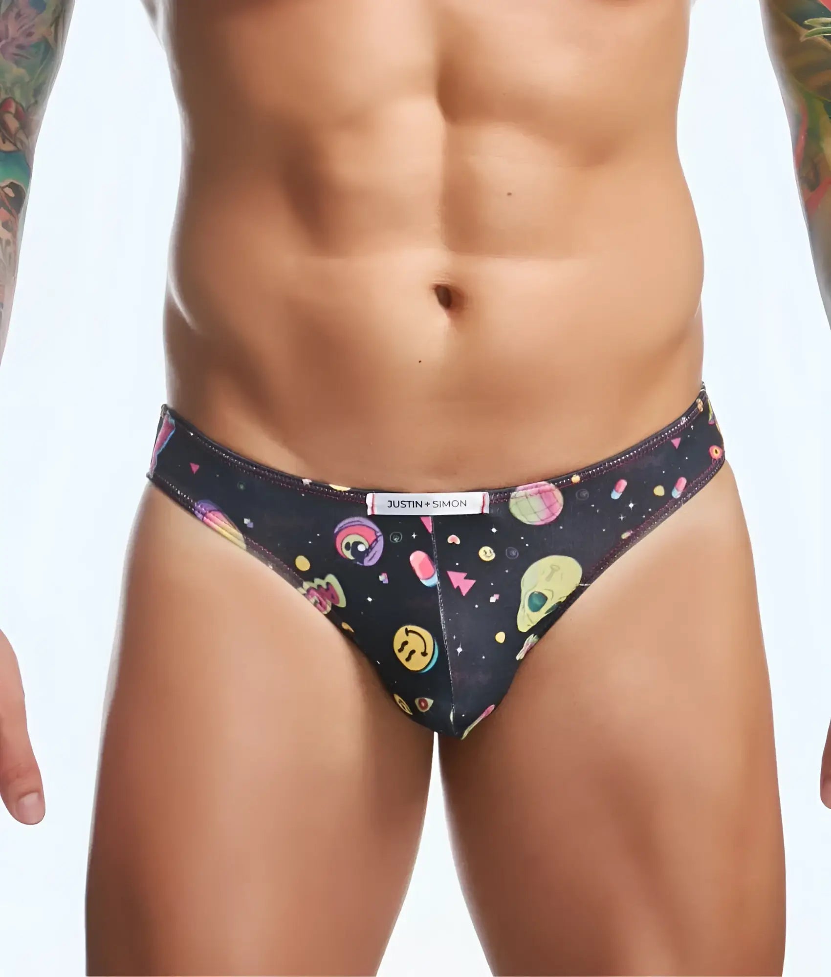 Black justin + simon classic mens bikini briefs with colorful alien smiley face and geometric space-themed pattern