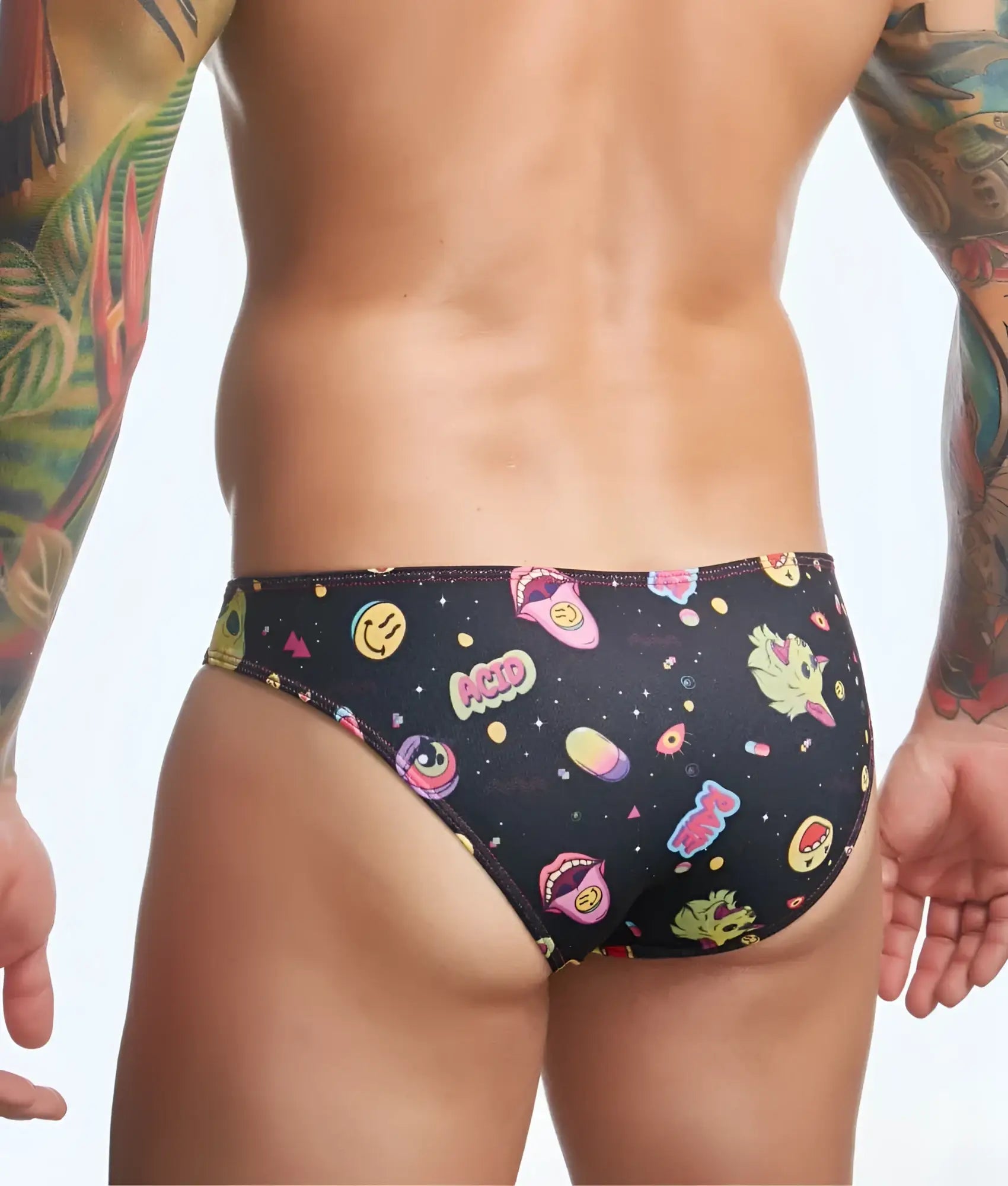 Black swim trunks with vibrant smiling faces lips and colorful space-themed graphics from justin simon classic mens bikini fun prints