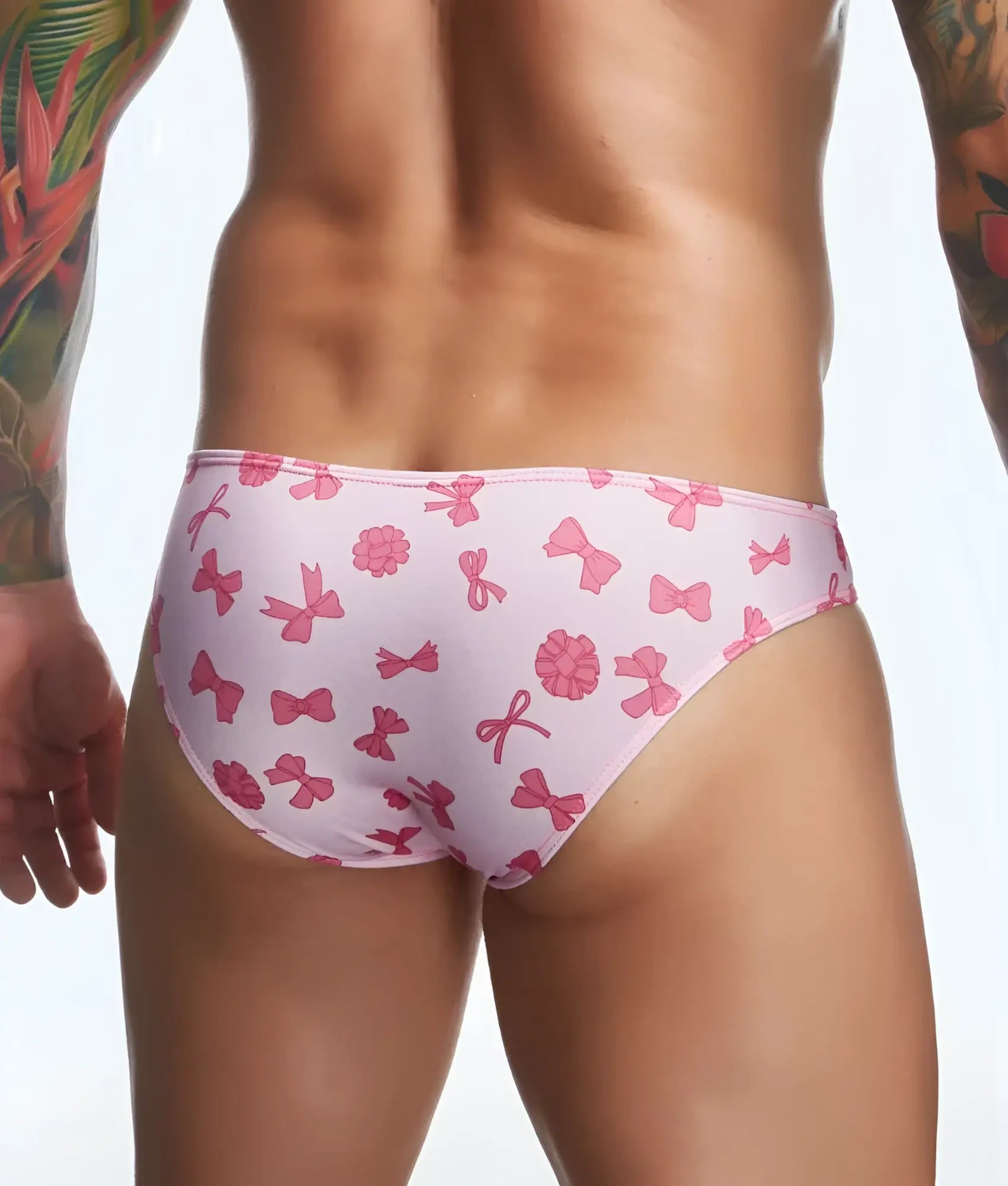 Justin + Simon classic mens bikini swim trunks with pink bow and flower pattern for fun prints collection