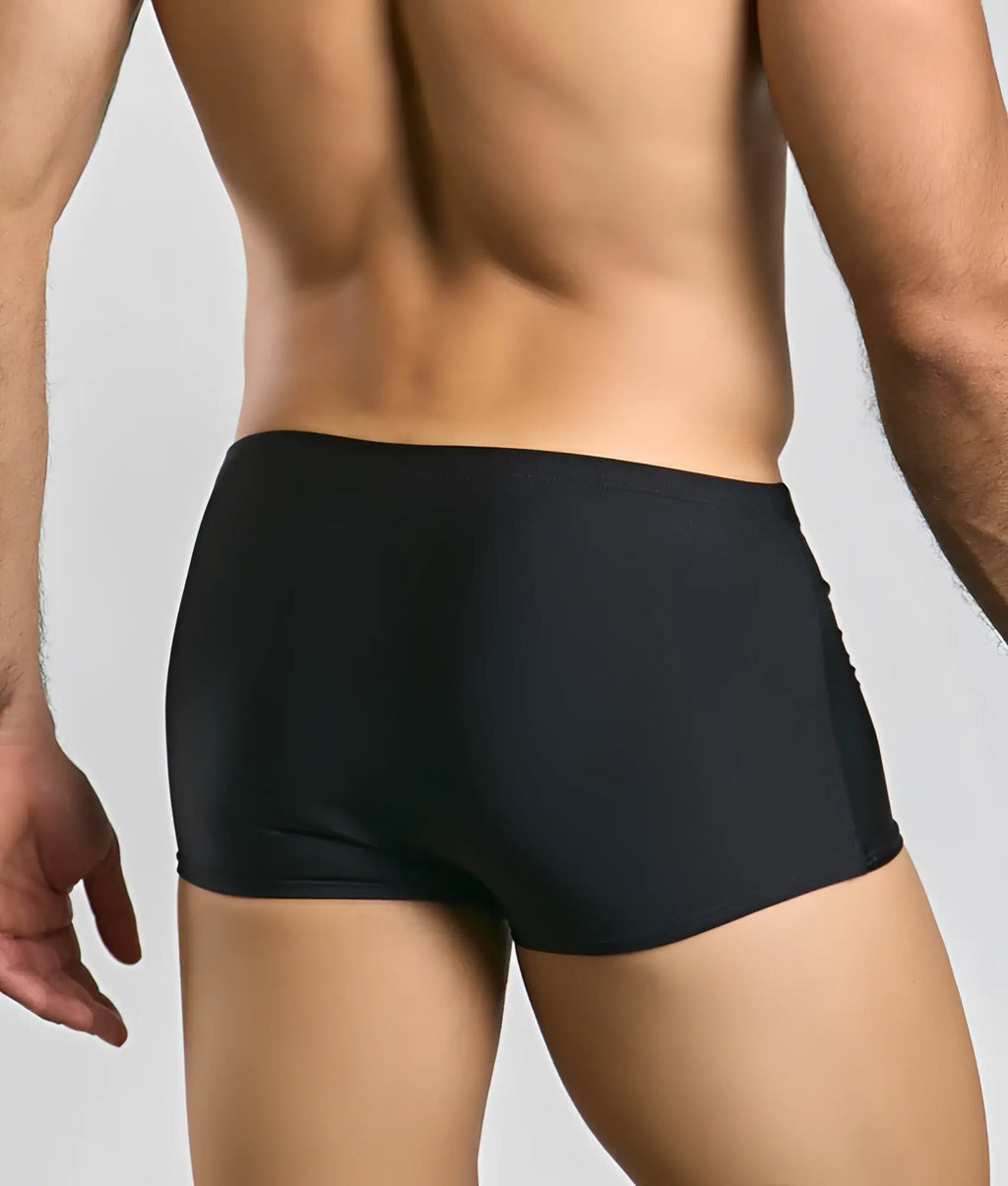 Black form-fitting boxer briefs justin + simon classic boxer with smooth stretchy fabric and subtle side seam detailing