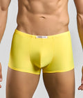 Bright yellow justin simon classic boxer briefs with smooth form-fitting fabric and white brand tag at the waistband