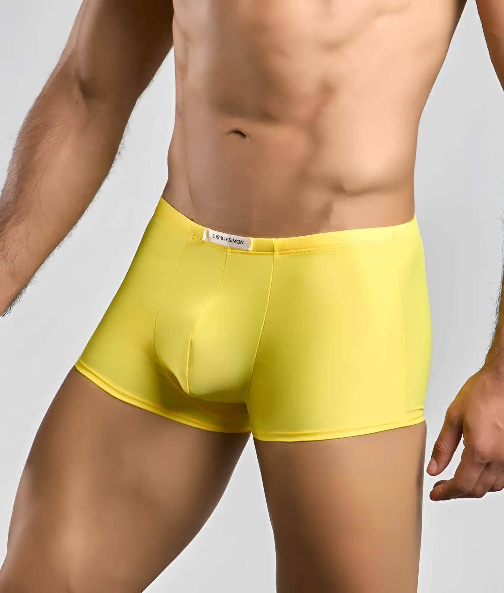 Bright yellow Justin + Simon Classic Boxer men’s briefs with smooth stretchy fabric and branded waistband tag
