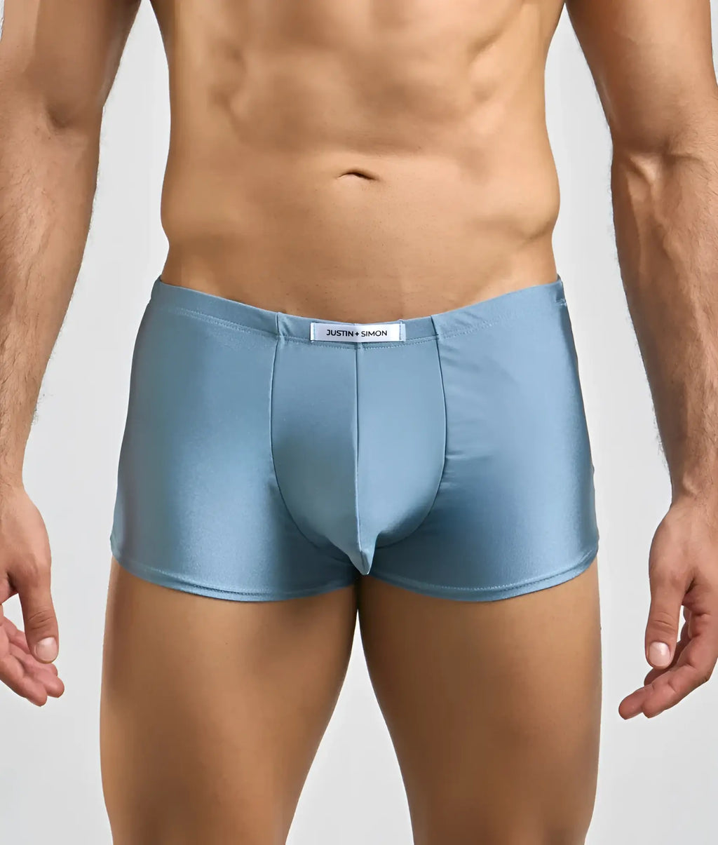 Light blue shiny satin briefs with white brand tag at waistband from Justin and Simon classic boxer collection