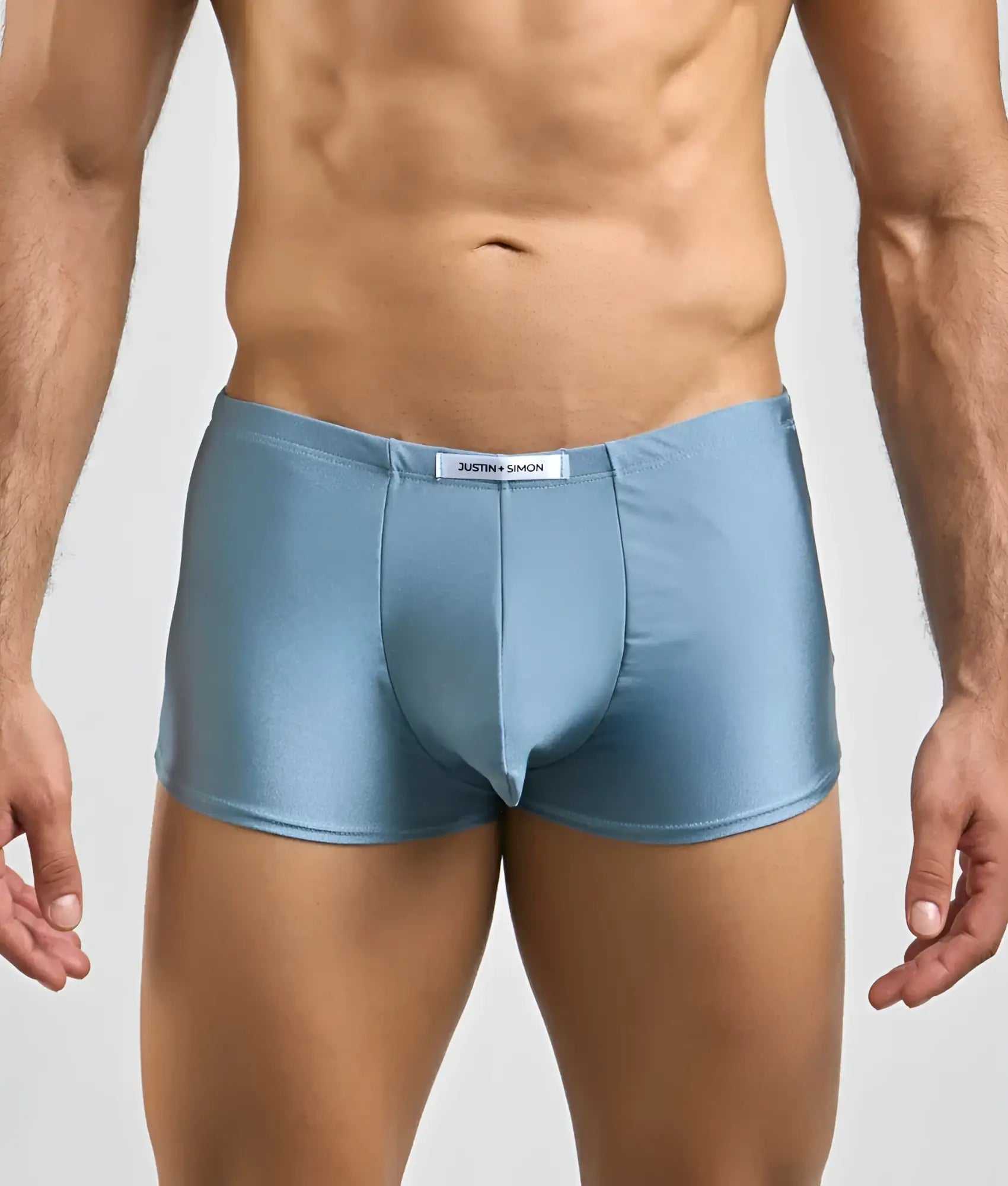 Light blue shiny satin briefs with white brand tag at waistband from Justin and Simon classic boxer collection
