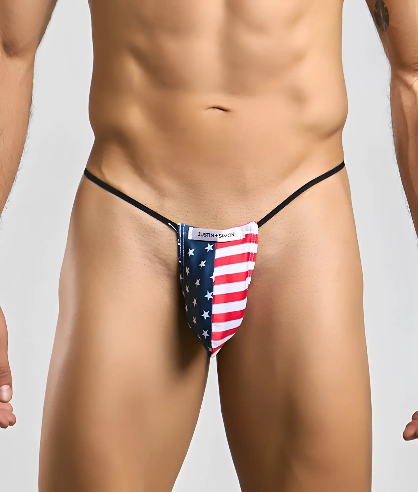 Justin Simon classic g-string bulge thong with American flag design featuring red white stripes and blue stars on stretchy fabric