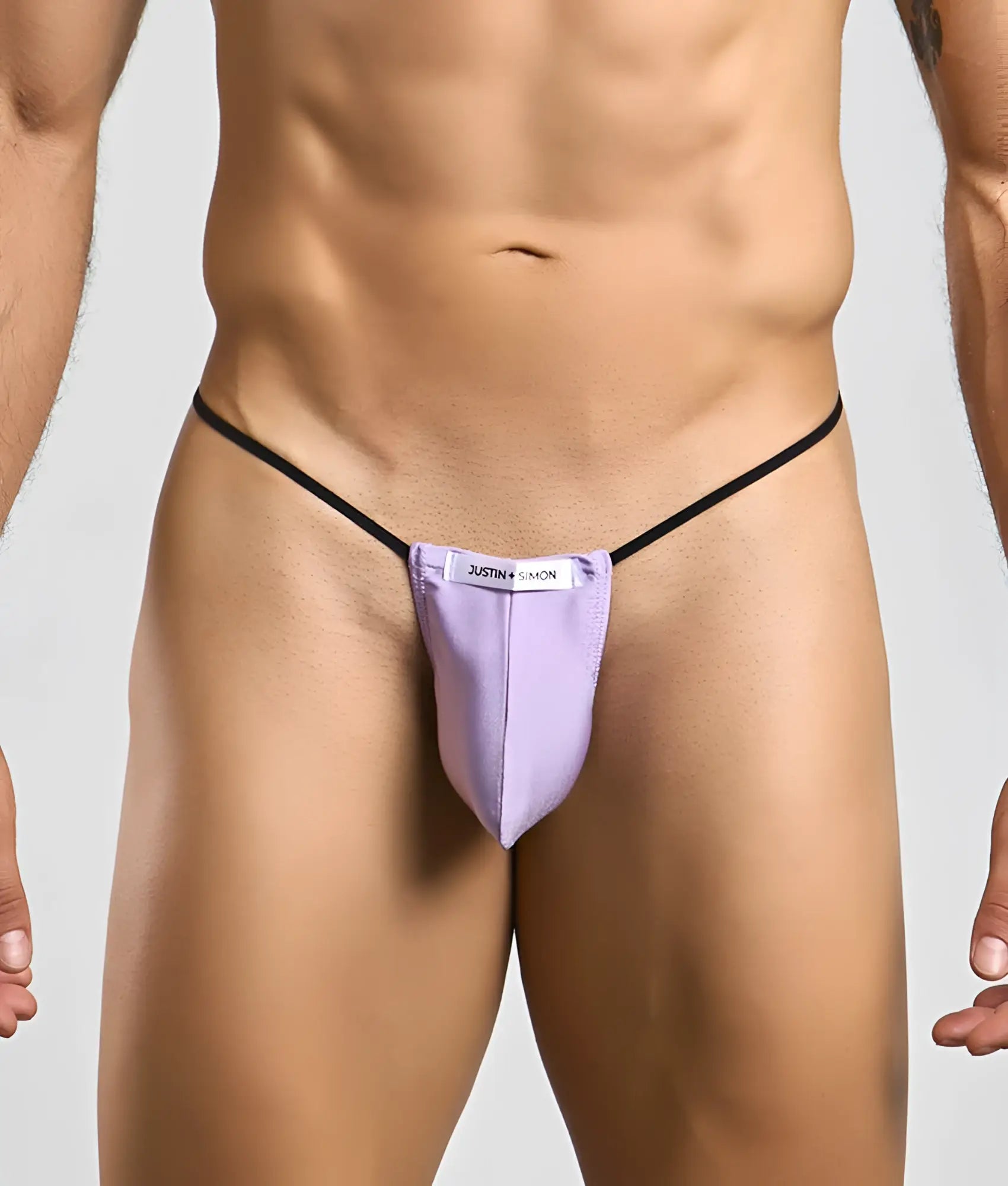 Purple justin simon classic g-string bulge thong with black elastic straps showing front view