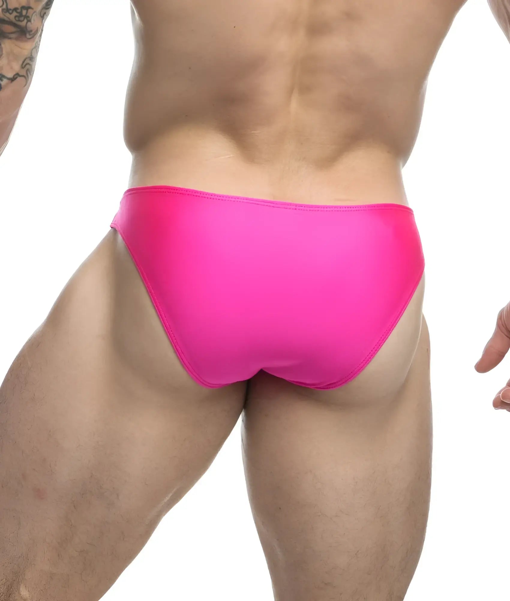 Bright pink sleek form-fitting swim trunks from Justin Simon classic mens bikini collection made for swimming