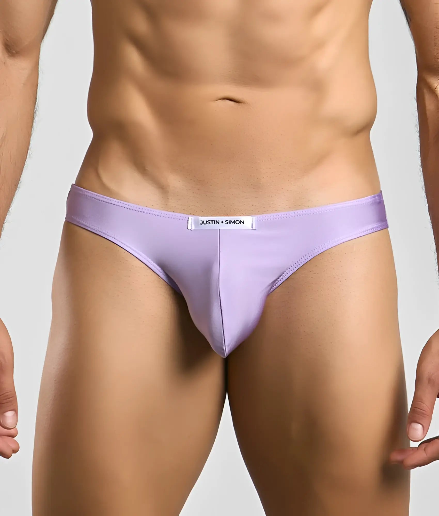 Lavender-colored Justin Simon classic mens bikini briefs with sleek form-fitting design and subtle waistband brand tag