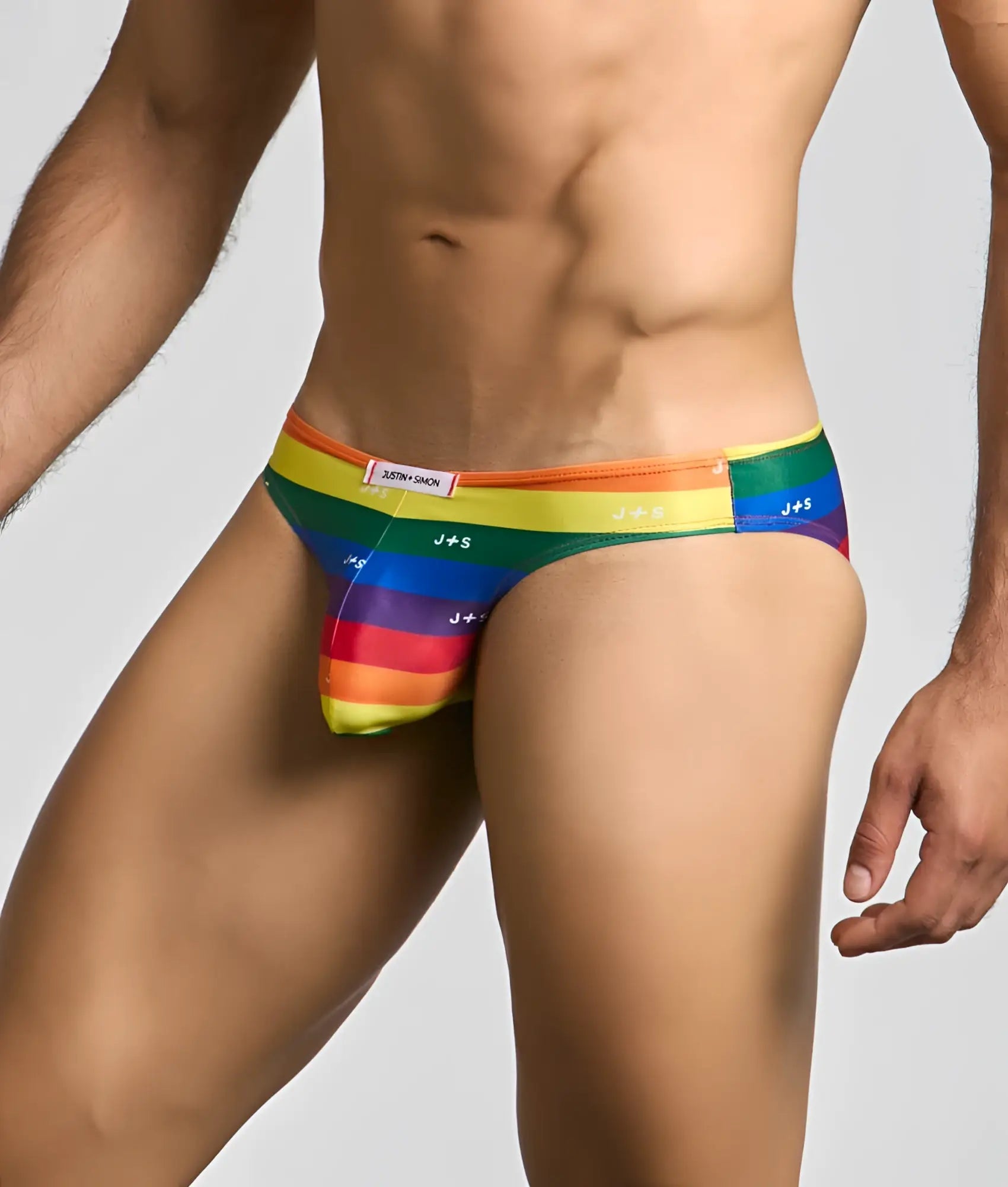 Rainbow-striped men’s briefs with j plus s branding and a snug form-fitting design from Justin plus Simon classic bikini