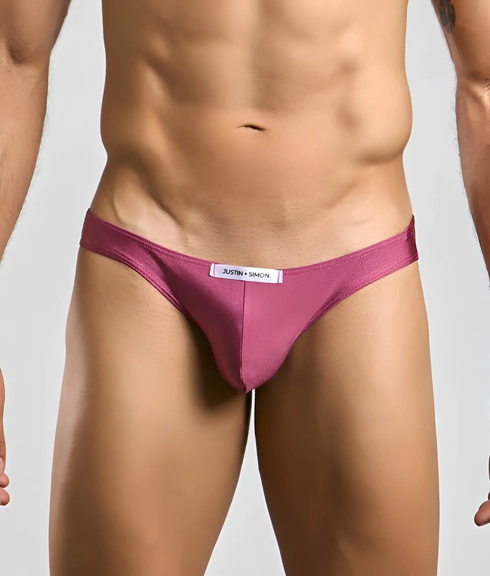 Justin simon classic mens bikini brief in sleek magenta with smooth fabric finish and white waistband label