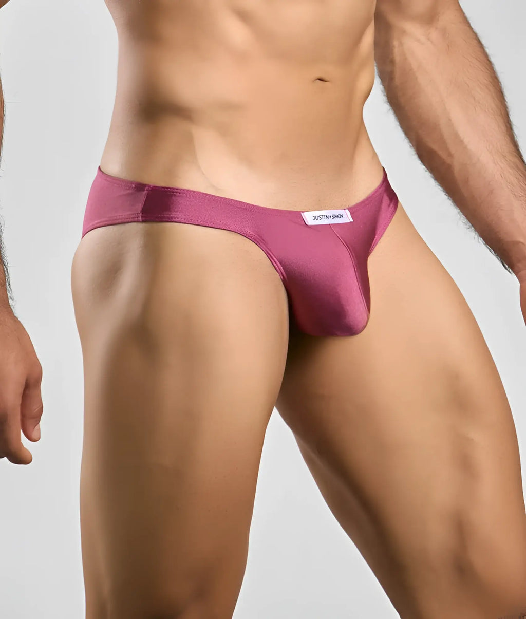 Justin plus simon classic mens bikini in sleek magenta satin with minimalist design and white brand tag on waistband