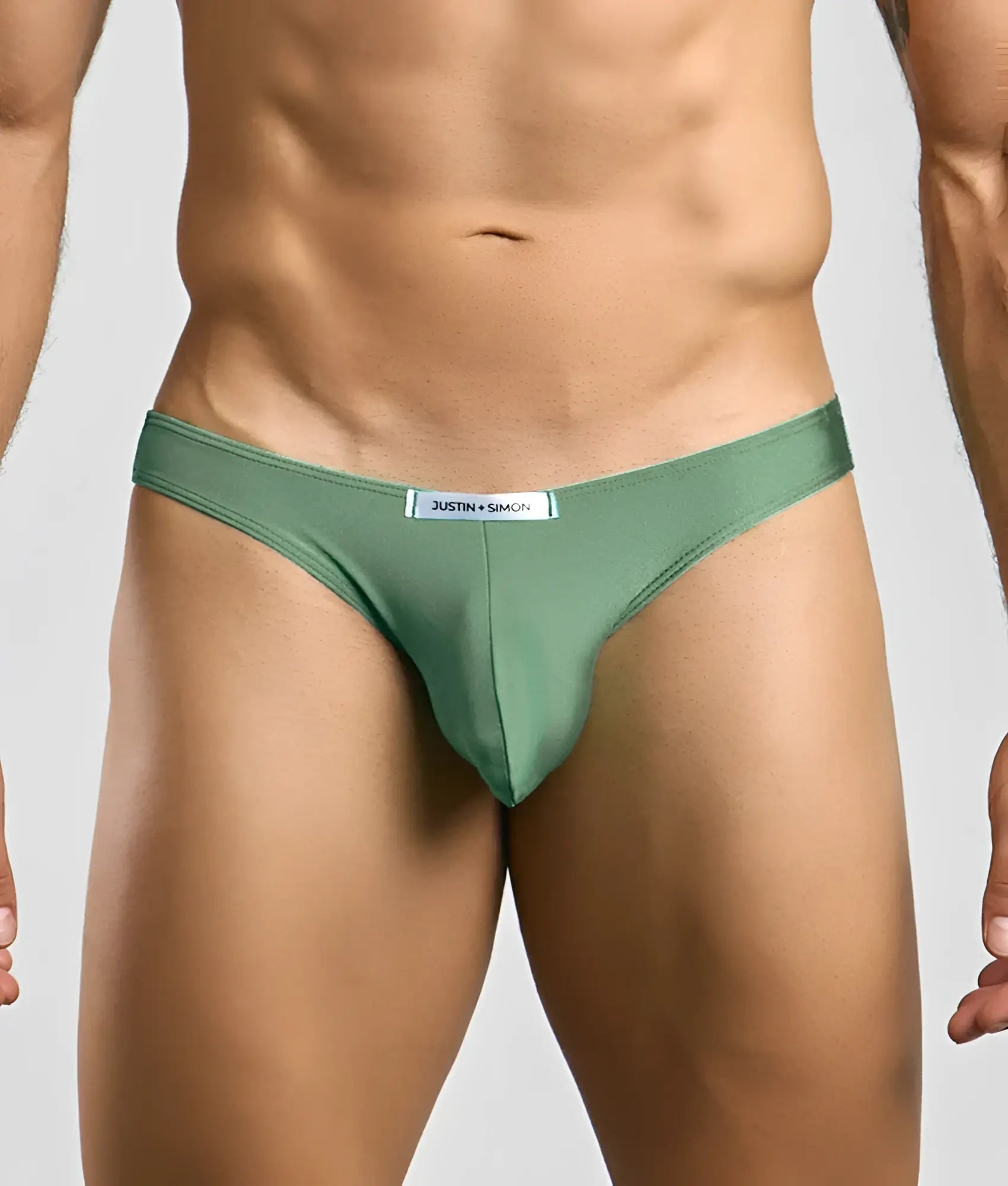 Justin + Simon Classic mens bikini sleek olive-green thong made of smooth fabric with subtle sheen and branded waistband